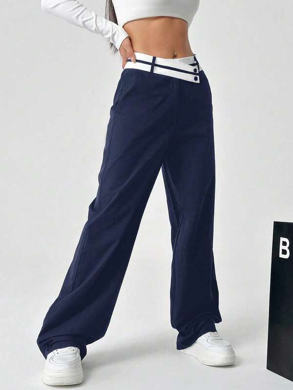 Women's patchwork color asymmetric waist straight leg track pants with pockets